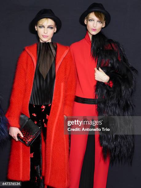 Models Karolina Smetek and Georgina Stojiljkovic are seen backstage ahead of the Giorgio Armani show during Milan Fashion Week Fall/Winter 2017/18 on...