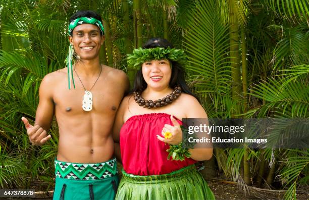 Laie Hawaii Polynesian Cultural Center performers in Hawaii traditional outfits .