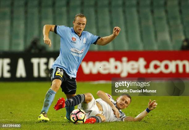 Sydney's Rhyan Grant fights for the ball against Melbourne's Besart Berisha during the round 22 A-League match between Sydney FC and Melbourne...
