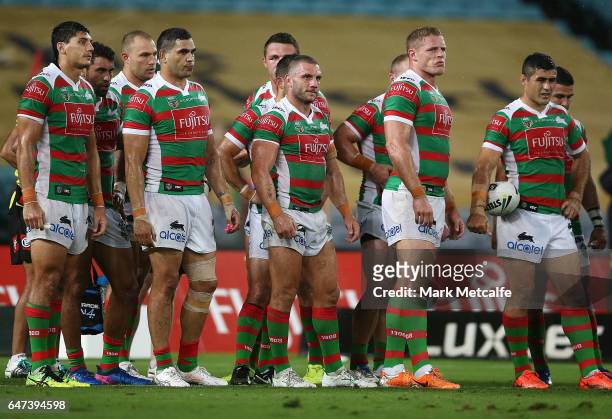Robbie Farrah of the Rabbitohs and team mates looks dejected after conceding a try during the round one NRL match between the South Sydney Rabbitohs...