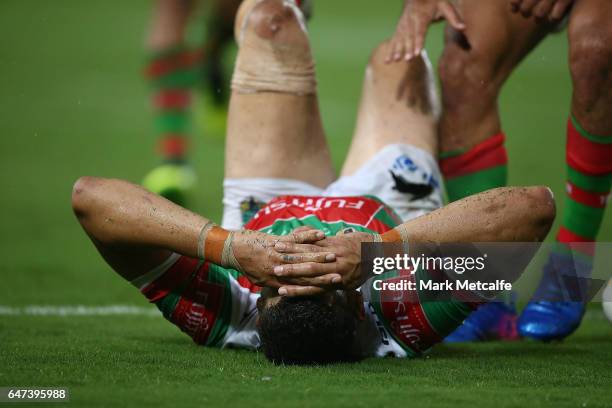 Greg Inglis of the Rabbitohs holds his head after scoring a try during the round one NRL match between the South Sydney Rabbitohs and the Wests...