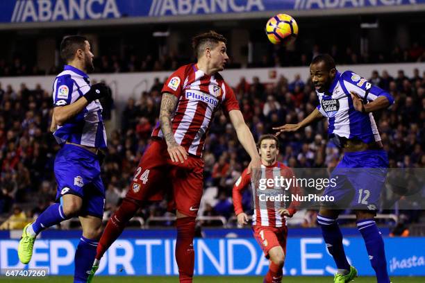 Jose Maria Gimenez defender of Atletico de Madrid and Sidnei Rechel of Deportivo de La Coruña jump to head the ball during the La Liga Santander...
