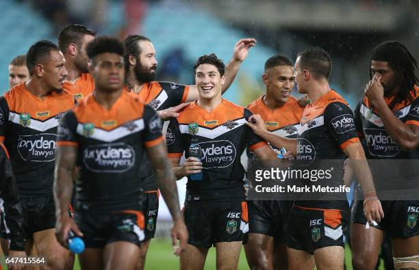Mitch Moses celebrates with team mates after victory in the round one NRL match between the South Sydney Rabbitohs and the Wests Tigers at ANZ...