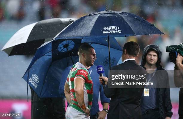 Robbie Farah of the Rabbitohs is interviewed during the round one NRL match between the South Sydney Rabbitohs and the Wests Tigers at ANZ Stadium on...