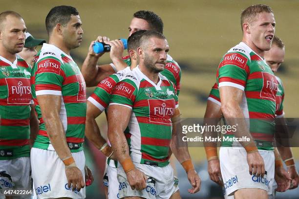 Robbie Farrah of the Rabbitohs and team mates look dejected after conceding a try during the round one NRL match between the South Sydney Rabbitohs...