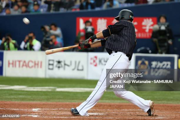 Infielder Sho Nakata of Japan hits a solo homer in the top of the seventh inning during the World Baseball Classic Warm-Up Game between Japan and...