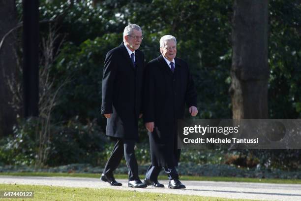 Germany state President Joachim Gauck and Austrian's state President Alexander Van der Bellen walk in the park of the Bellevue Castle ahead of the...