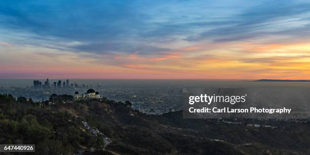 sunset over the los angeles basin and griffith observatory - hollywood hills fotografías e imágenes de stock