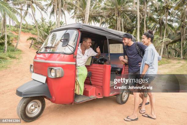 mature rickshaw driver talking to mid adult backpackers - gap year stock pictures, royalty-free photos & images