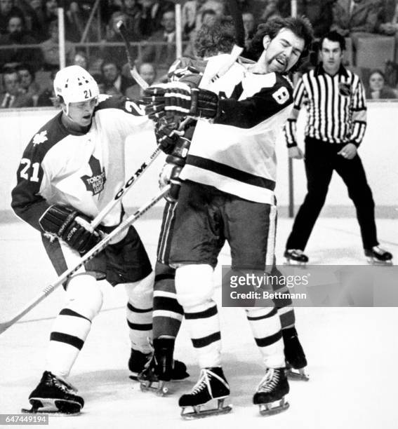 Jack Valiquette , of the Toronto Maple Leafs discovers here 2/18 that even a high stick from a teammate, Borje Salming , can be something to try to...