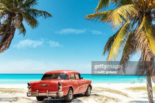 old red american car on varadero beach in cuba - cubano imagens e fotografias de stock