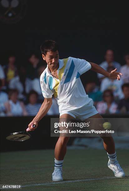 American tennis player Michael Chang pictured in action competing reach the fourth round of the Men's Singles tournament at the Wimbledon Lawn Tennis...