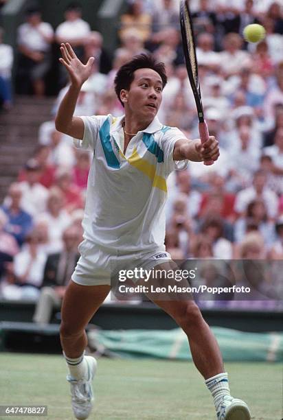 American tennis player Michael Chang pictured in action competing to reach the fourth round of the Men's Singles tournament at the Wimbledon Lawn...