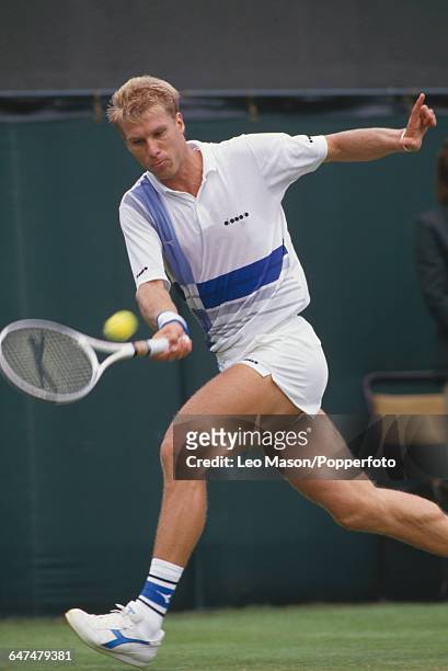 English tennis player Andrew Castle pictured in action competing to progress to the second round of the Men's Singles tournament at the Wimbledon...