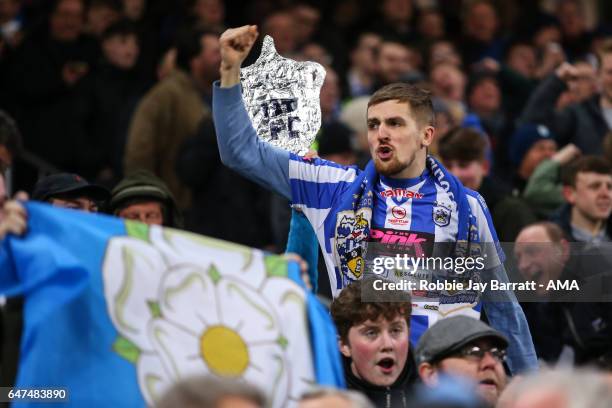 Huddersfield Town fans celebrate during The Emirates FA Cup Fifth Round Replay between Manchester City and Huddersfield Town at the Etihad Stadium on...