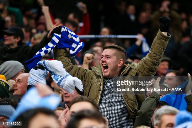 Huddersfield Town fans celebrate during The Emirates FA Cup Fifth Round Replay between Manchester City and Huddersfield Town at the Etihad Stadium on...