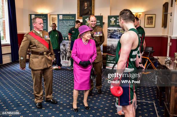 Queen Elizabeth II speaks to soldiers as she visitsThe Royal Welsh Regimental Family to mark St David's Day at Lucknow Barracks on March 3, 2017 in...