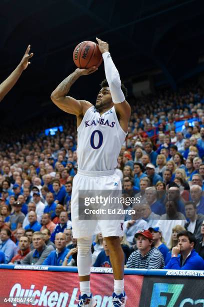 Frank Mason III of the Kansas Jayhawks shoots against the Oklahoma Sooners at Allen Fieldhouse on February 27, 2017 in Lawrence, Kansas.