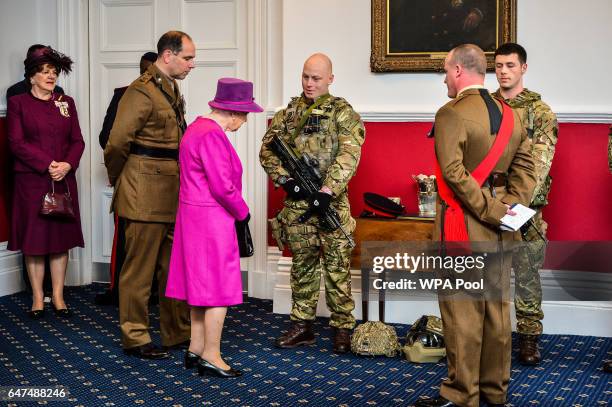 Queen Elizabeth II speaks to soldiers as she visitsThe Royal Welsh Regimental Family to mark St David's Day at Lucknow Barracks on March 3, 2017 in...