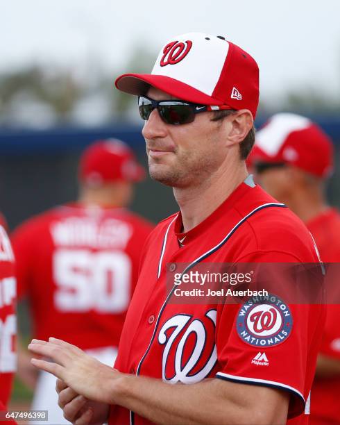 Max Scherzer of the Washington Nationals looks on during a morning workout prior to a spring training game against the St Louis Cardinals at The...
