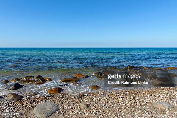 pebble beach with boulders in summer - kattegat stock-fotos und bilder