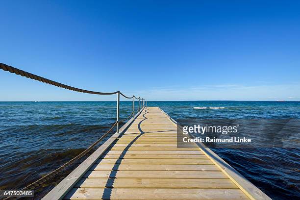 wooden jetty on beach - kattegat stock-fotos und bilder