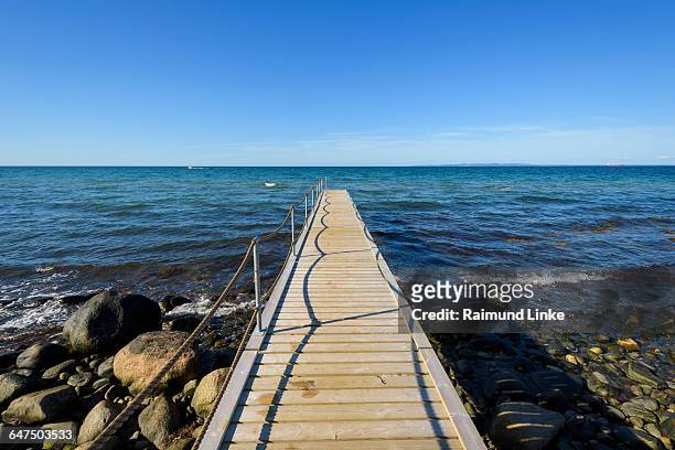 wooden jetty on beach - kattegat stock-fotos und bilder