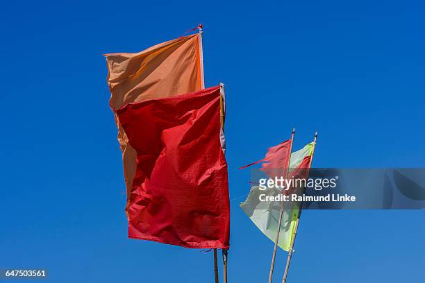 colorful, marking flags for fishing nets - kattegat stock pictures, royalty-free photos & images
