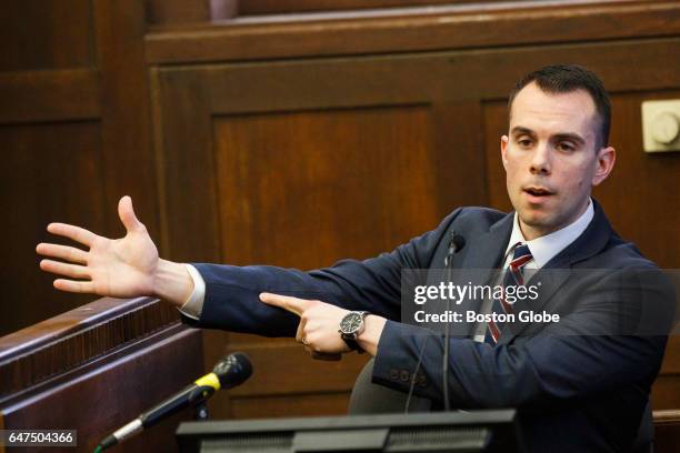 Former Boston EMT Todd Rich points to his arm to describe a gun shot wound as he delivers testimony during the double murder trial of former New...