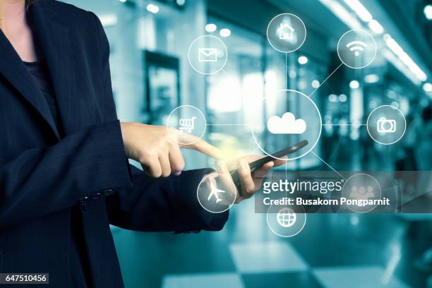 businesswomen hand using cellphone omni-channel shopping ctr with hi tech icon flow on blur abstract background shopping mall department store - omnichannel imagens e fotografias de stock