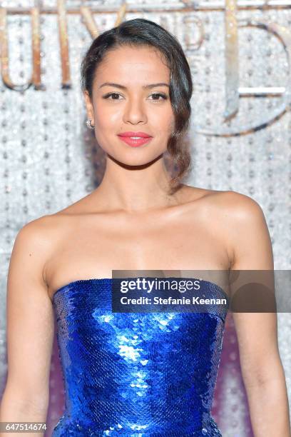 Gugu Mbatha-Raw arrives at the world premiere of DisneyÕs new live-action Beauty and the Beast photographed in front of the Swarovski crystal wall on...