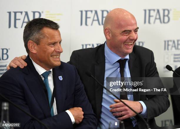 President, Gianni Infantino and The Chief Executive Officer of The FA, Martin Glenn, share a joke during the IFAB Annual Meeting at Wembley Stadium...