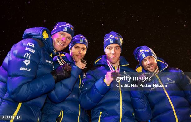 Daniel Richardsson, Marcus Hellner, Calle Halfvarsson and Johan Olsson of Sweden during the medal ceremony following the men's cross country relay...