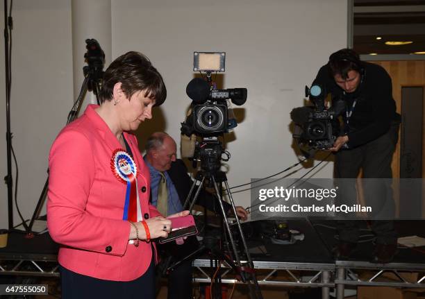 Democratic Unionist party leader and former First Minister Arlene Foster checks her phone as the Northern Ireland Stormont election count takes place...