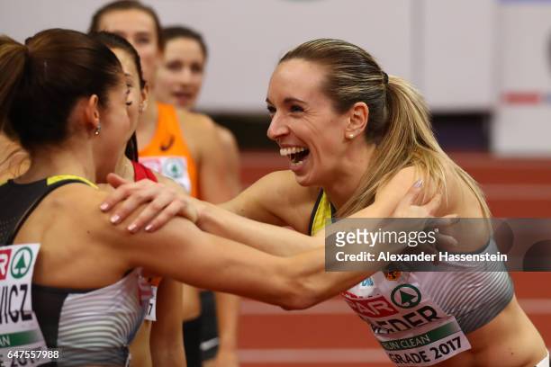 Gold medalist Cindy Roleder of Germany celebrates with bronze medalist Pamela Dutkiewicz of Germany following the Women's 60 metres hurdles final on...