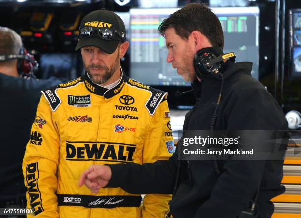 Matt Kenseth, driver of the DeWalt Flexvolt Toyota, and crew chief Jason Ratcliff stands in the garage area during practice for the Monster Energy...