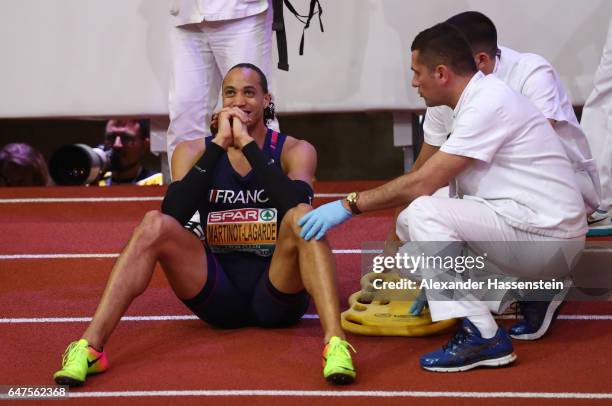 Silver medalist Pascal Martinot-Lagarde of France receives medical attention following the Men's 60 metres hurdles final on day one of the 2017...