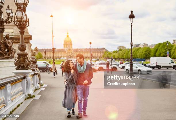 enjoying a romantic day in the city - couple paris stock pictures, royalty-free photos & images