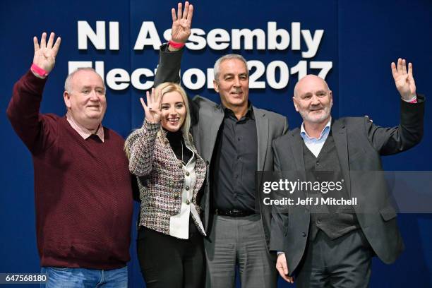 Fra McCann, Orlaithi Flynn, Pat Sheehan, and Alex Maskey stand for a photograph after winning four seats for Sinn Fein in West Belfast in the...