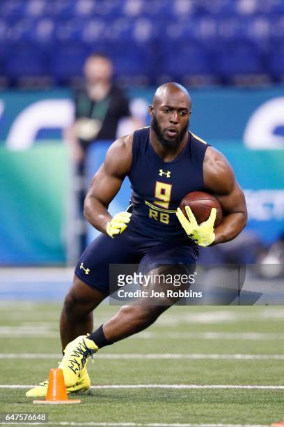 Running back Leonard Fournette of LSU runs the ball during a drill on day three of the NFL Combine at Lucas Oil Stadium on March 3, 2017 in...