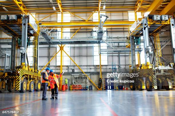 at work on the warehouse floor - distribution warehouse stock pictures, royalty-free photos & images