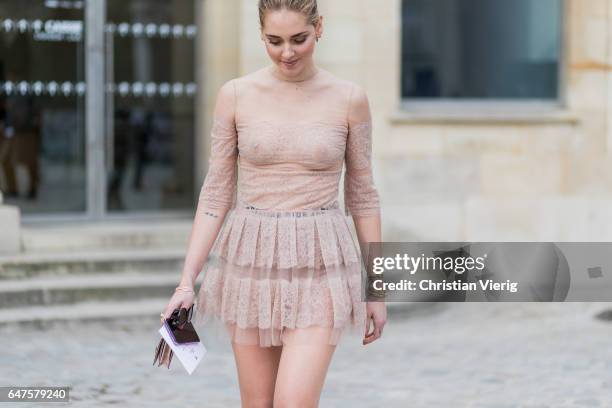 Chiara Ferragni wearing nude pastel dress outside Dior on March 3, 2017 in Paris, France.