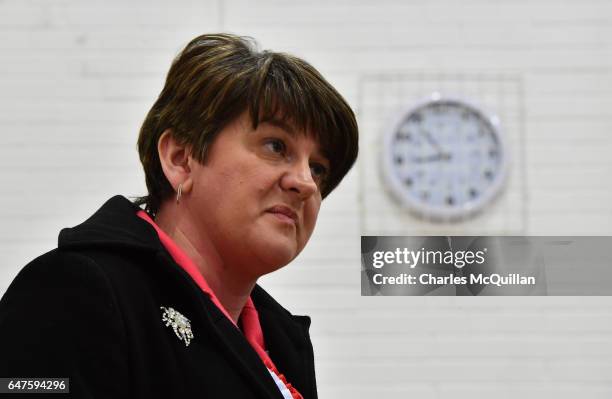 Democratic Unionist party leader and former First Minister Arlene Foster stands under a clock as she waits to make her speech at the Northern Ireland...