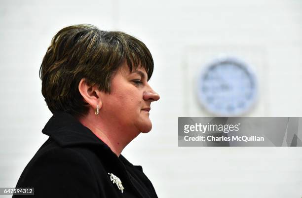 Democratic Unionist party leader and former First Minister Arlene Foster stands under a clock as she waits to make her speech at the Northern Ireland...