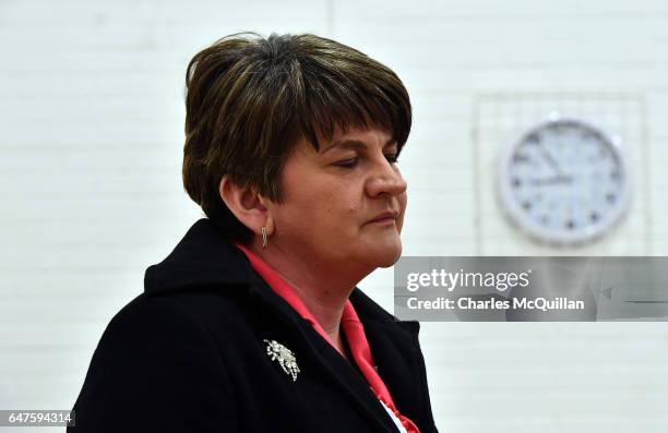 Democratic Unionist party leader and former First Minister Arlene Foster stands under a clock as she waits to make her speech at the Northern Ireland...