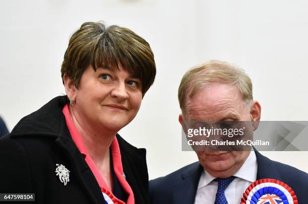 Democratic Unionist party leader and former First Minister Arlene Foster consoles Lord Morrow who lost his seat in the Northern Ireland Stormont...