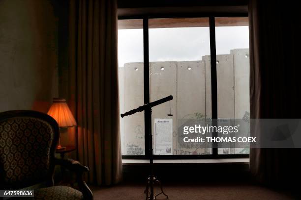Picture taken from street artist Banksy's newly opened Walled Off hotel in the Israeli occupied West Bank town of Bethlehem, on March 3 shows...