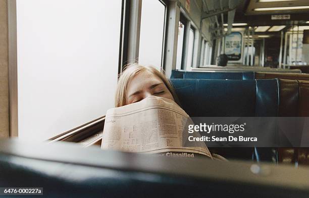 woman sleeping on train - treincoupé stockfoto's en -beelden