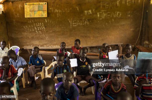 Chuol from southern Unity State, attends class with other internally displaced children and local villagers in a UNICEF-sponsored Child Friendly...