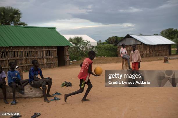 Chuol from southern Unity State, plays soccer with other local and internally displaced children at a school in a village in Unity State, South...